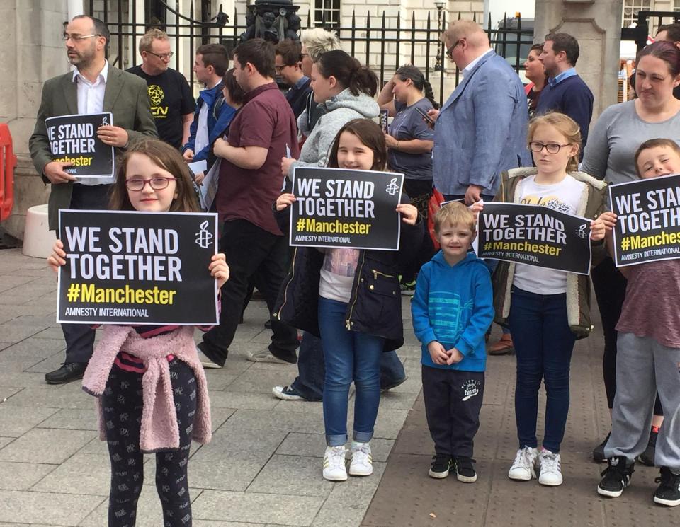 People gather for a vigil outside Belfast City Hall