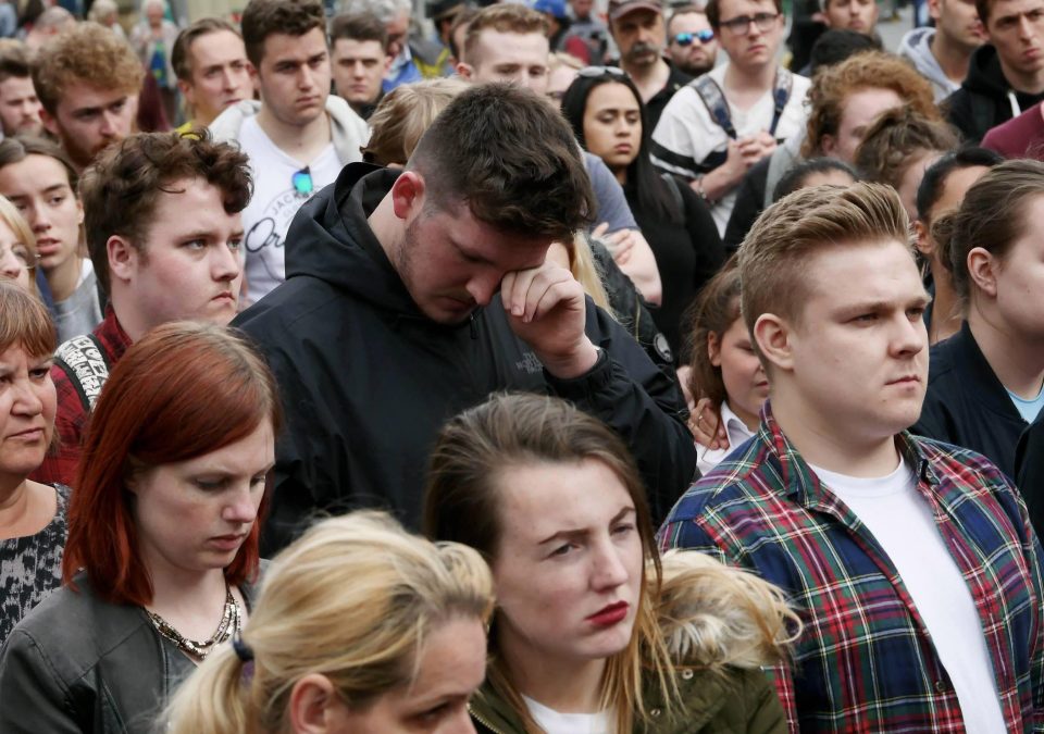 A mourner wipes away tears in Newcastle