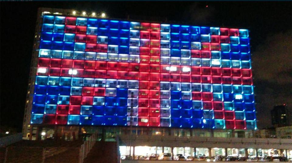 A municipal building in Tel Aviv, Israel joins the respectful tributes across the world