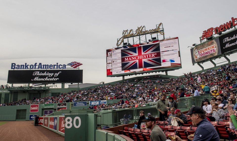 A moment of silence is held before a baseball game between the Boston Red Sox and the Texas Rangers in Boston, Massachusetts