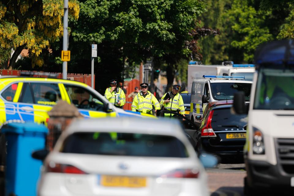  More than half a dozen police cars swooped on the quiet residential street this morning