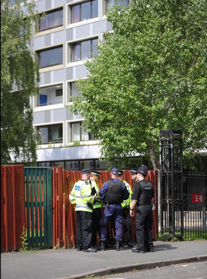  Cops gather near the site where a suspicious package was reported this morning in Manchester