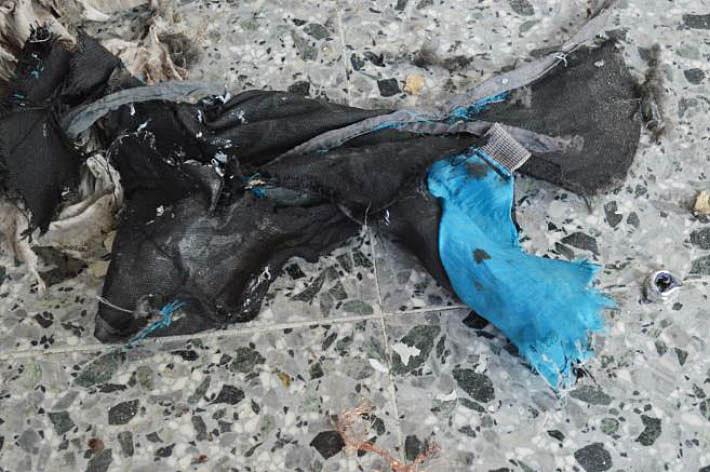  The ripped remains of the lightweight backpack used to carry the explosive