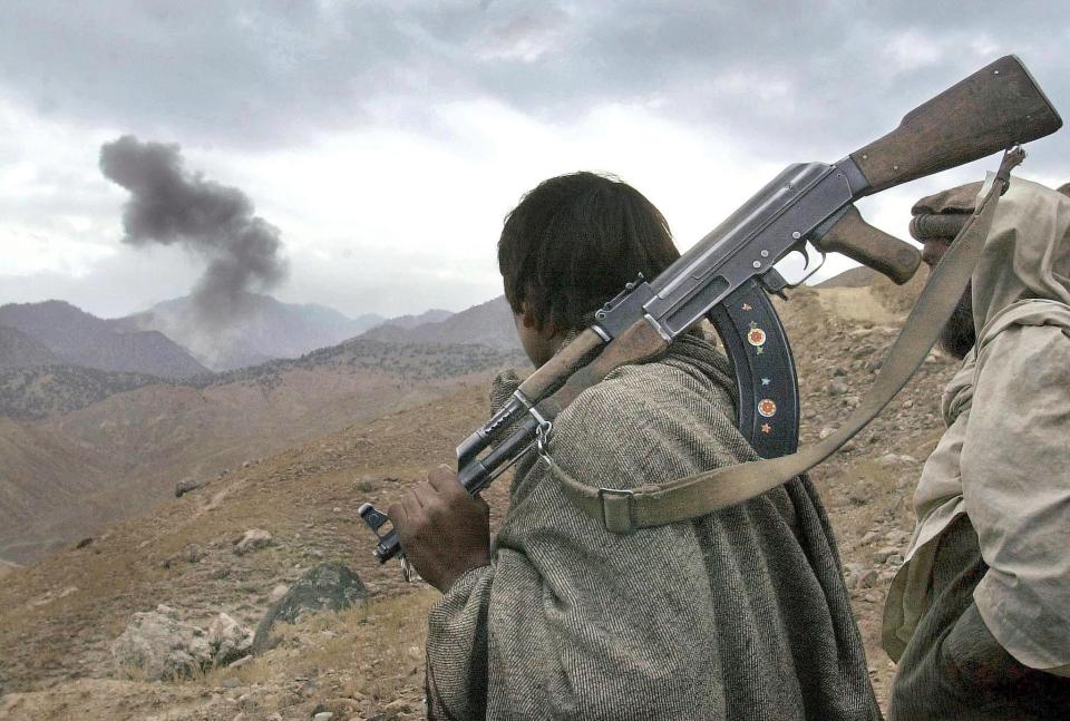 A fighter watches the US's attempts to bomb bin Laden into surrender in 2001