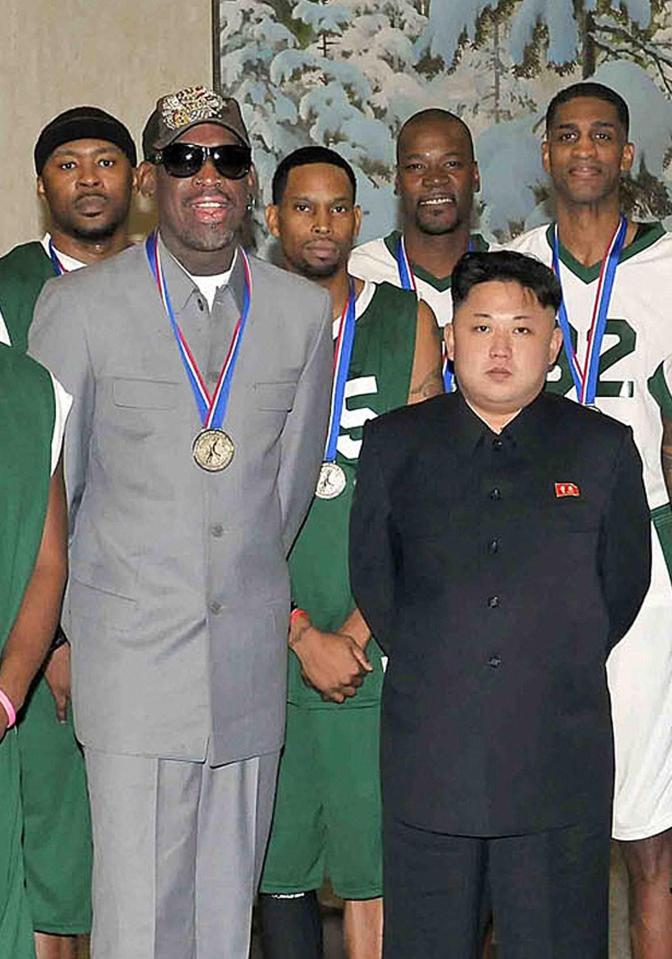  Rodman and Kim posing for a picture during an exhibition basketball game at Pyongyang Indoor Stadium in 2014