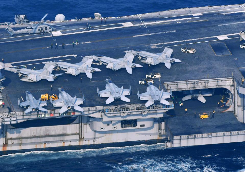 Warplanes line the deck of the USS Carl Vinson as part of the sea and air drills off the coast of North Korea