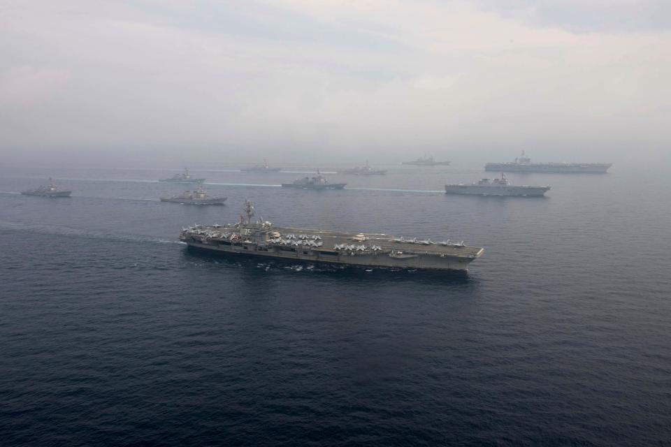  USS Ronald Reagan, front, and USS Carl Vinson, right rear, operating in the Sea of Japan