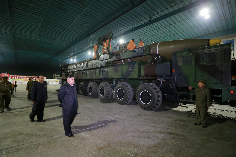 Kim Jong-un takes a moment to inspect his beloved ballistic rocket