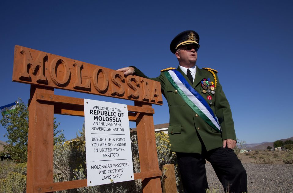President Baugh, a benevolent dictator, guards the border with the US