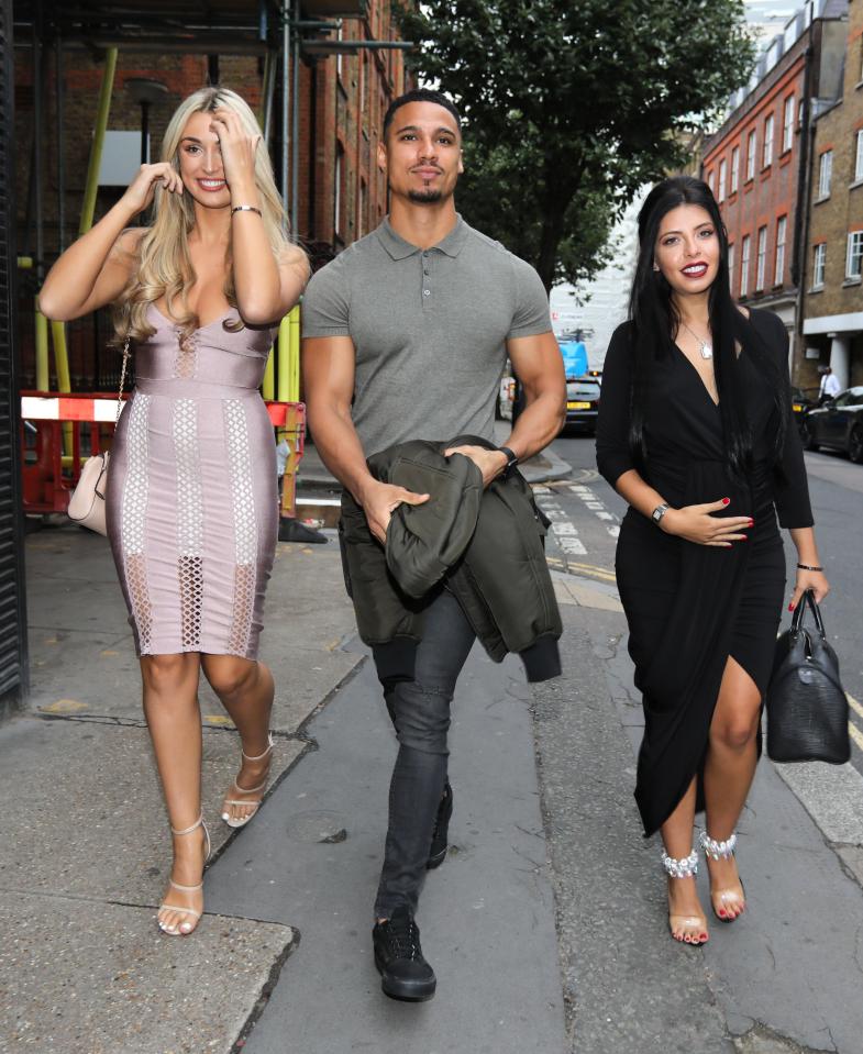  Cara kept her hand on her baby bump as she walked with Rykard and Rachel