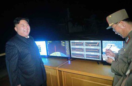  Kim Jong-Un gives a menacing smile at a recent missile test. The despot has threatened to launch an attack on the US