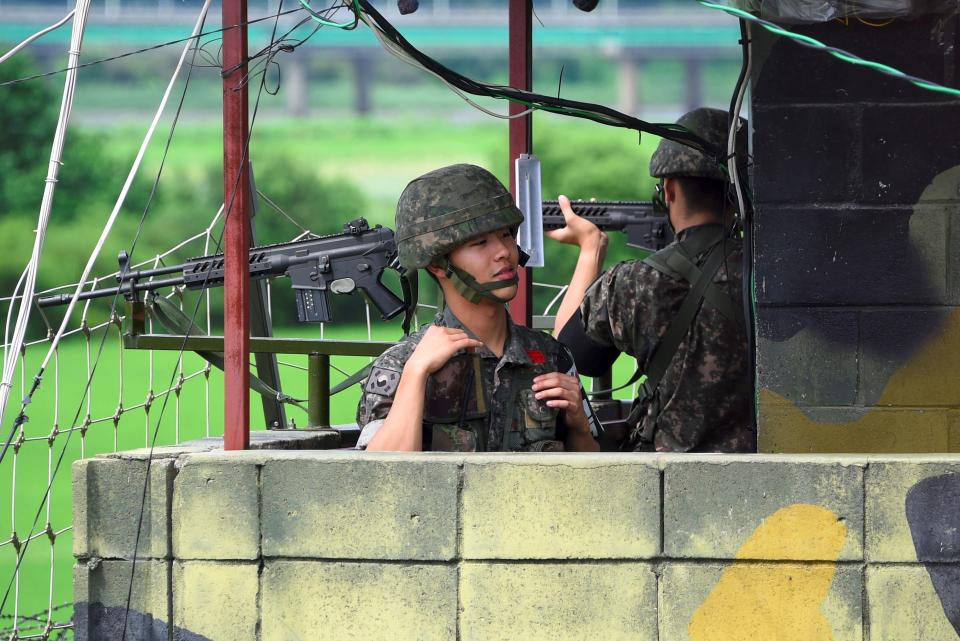  South Korean soldiers stand guard at a post near the Demilitarized Zone dividing two Koreas in the border city of Paju