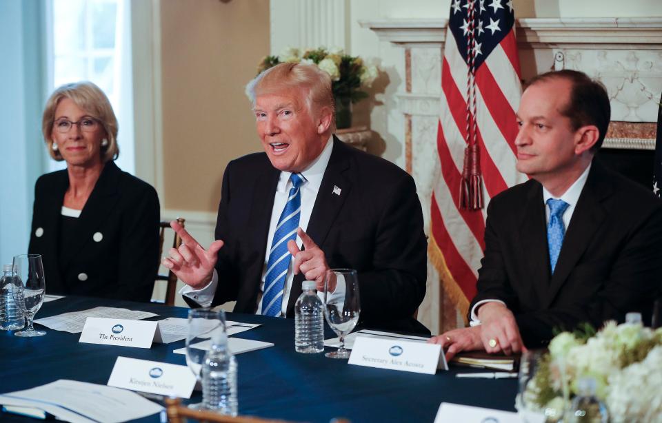  The President, pictured alongside cabinet members, continued his bitter war of words with the North Korean regime