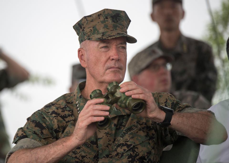  General Joseph Dunford observes Chinese army soldiers during an attack exercise
