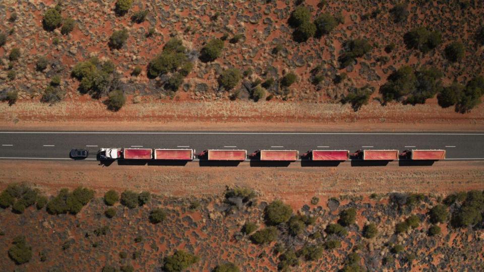  The manufacturer needed special permission to legally tow the seven-trailer road train, and closed off a large section of highway for the test
