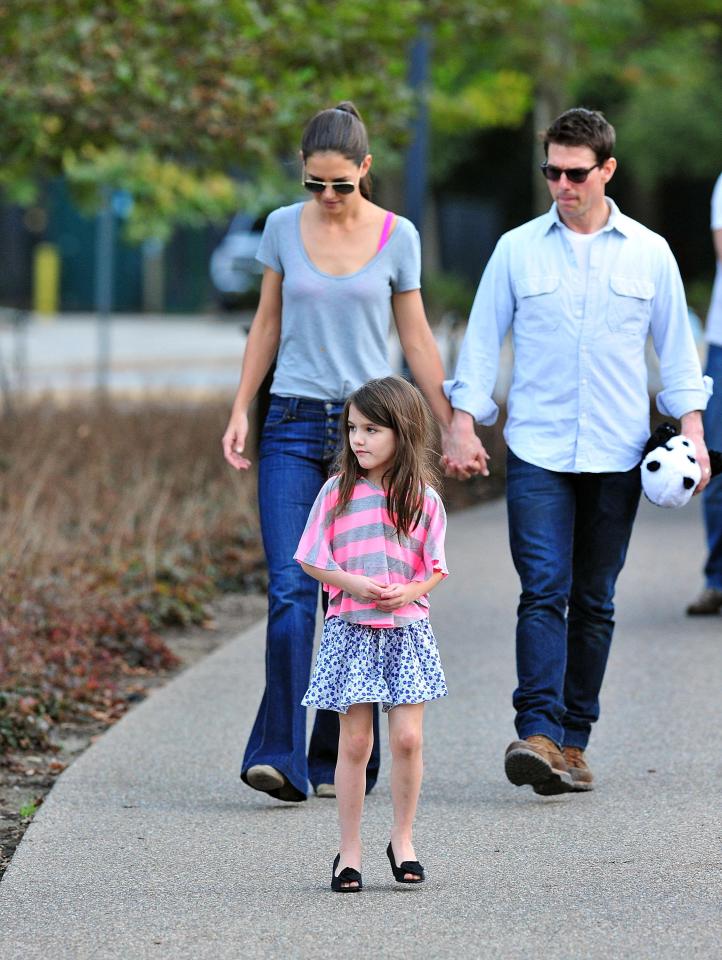 Katie and Tom out with mini-me daughter Suri in 2011