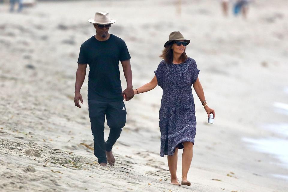 Katie Holmes - snapped hand in hand with Baby Driver actor Jamie Foxx - is the picture of a  woman in love — and one who has finally been able to turn off Cruise control