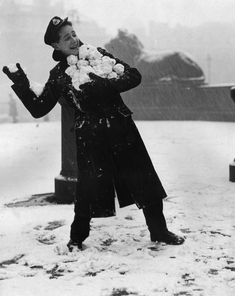  A telegram boy with an armful of snowballs in Trafalgar Square in 1946