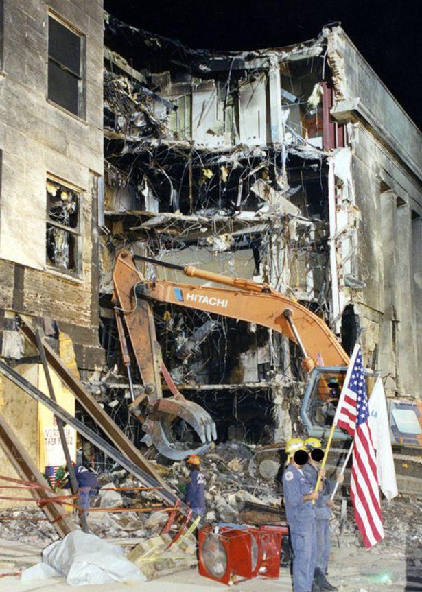  FBI and firefighters removing the carnage of the Pentagon after American Airlines flight 77 plunged into the building