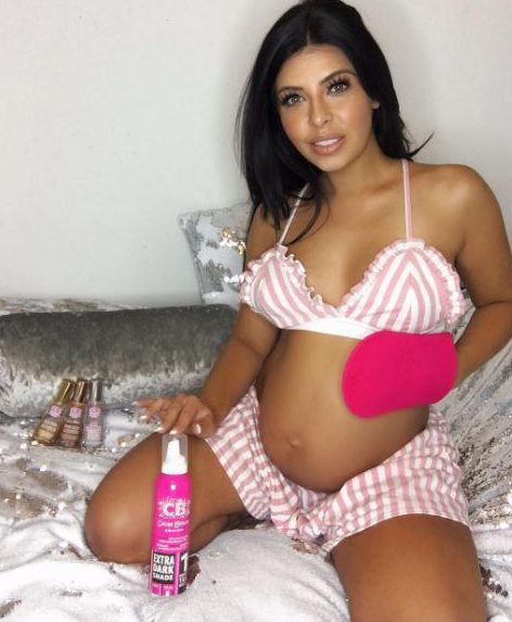  Cara De La Hoyde showed off her baby bump in this candy striped bikini