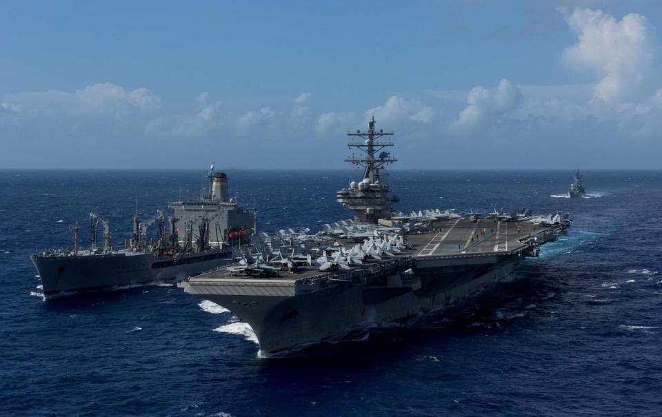  The impressive USS Ronald Reagan (right) with the USNS John Ericsson