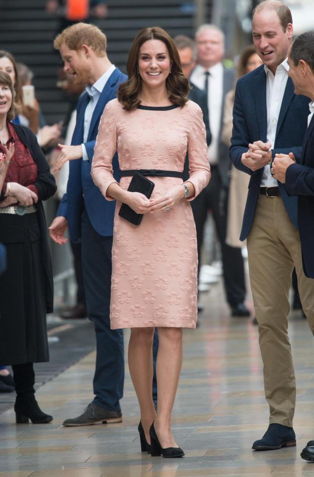  Kate and Wills and Harry spent much of their visit smiling brightly