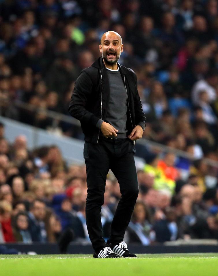  Pep Guardiola shouts instructions to his team
