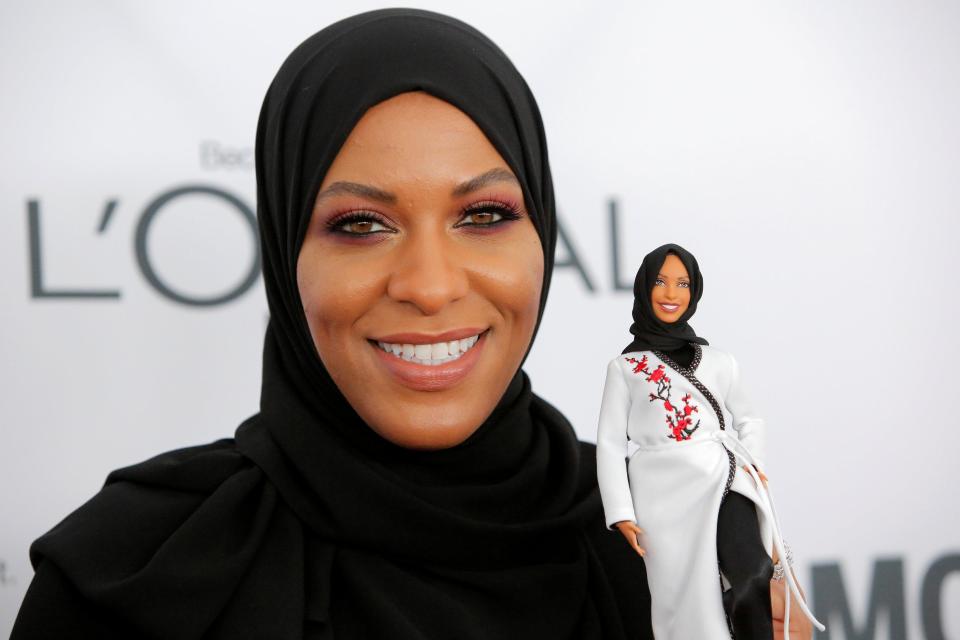 Olympic fencer Ibtihaj Muhammad holds a Barbie doll made in her likeness as she attends the 2017 Glamour Women of the Year Awards at the Kings Theatre in Brooklyn last night