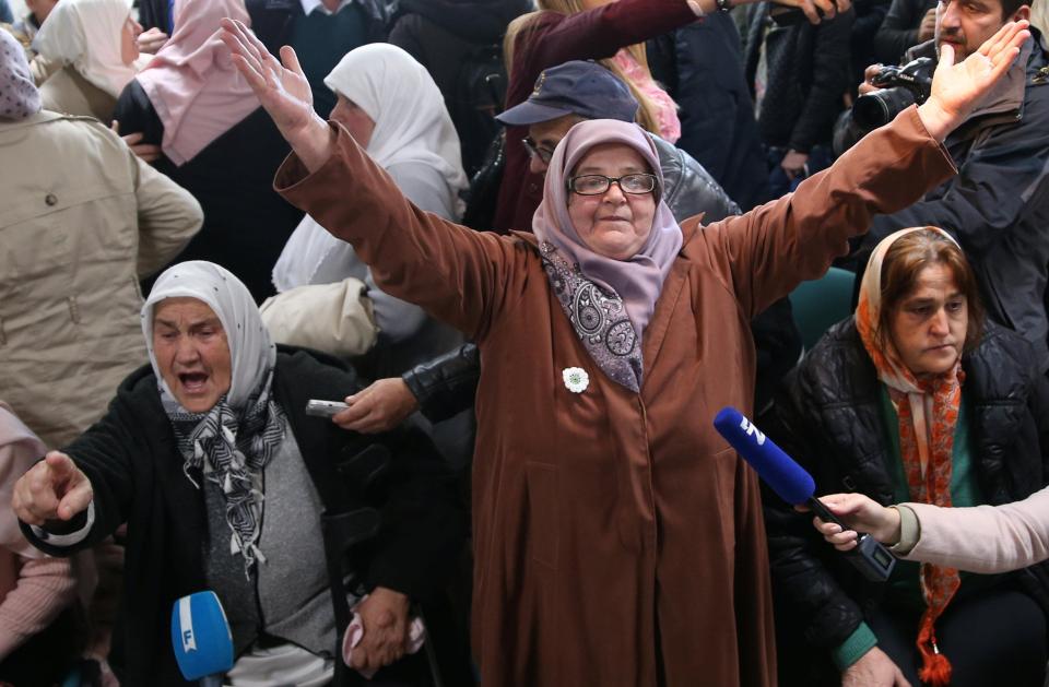 A Bosnian woman celebrates as she watches as Mladic is jailed for life 