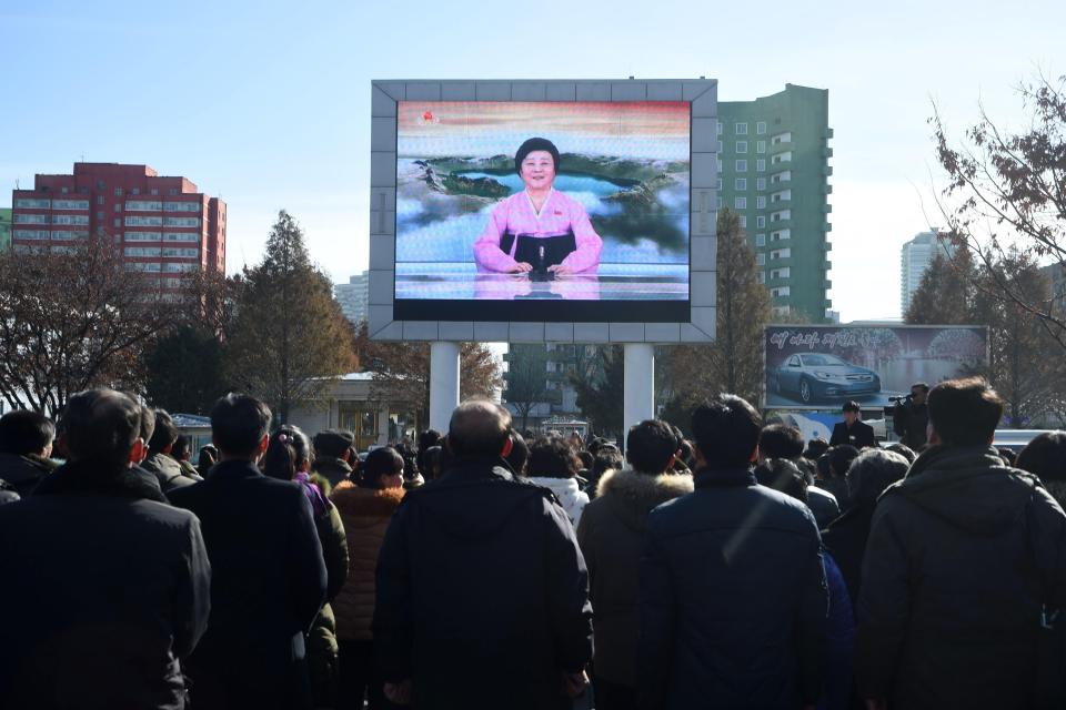  State news presenter Ri Chun-Hee breaks the news to the crowds