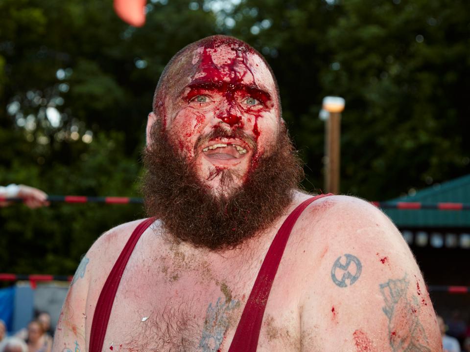  Hardcore wrestler Mean Mitch Page grins at the crowd during a 'death match'