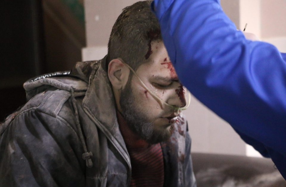 A wounded man gets treatment at a hospital