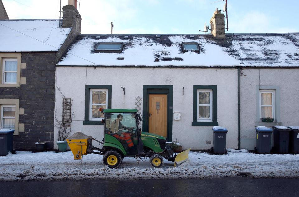 Pavements are cleared in Lauder in the Scottish Borders as police are urging motorists to drive with 'extreme caution'