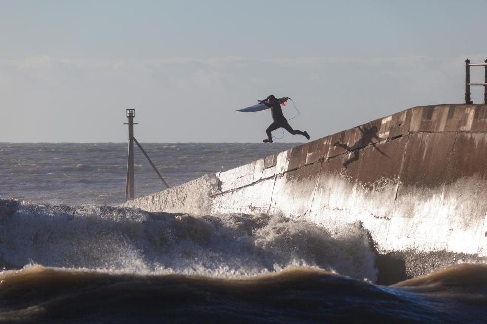 Surfers have been taking advantage of the swell in Hastings, East Sussex 