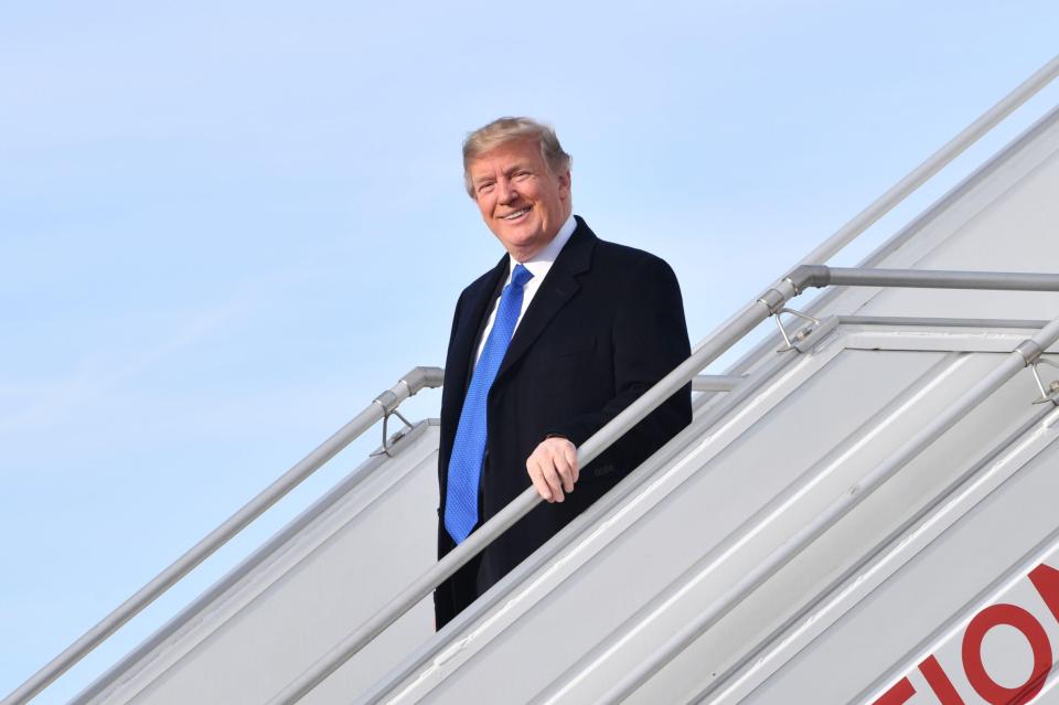 The US president is pictured after landing in the country this morning