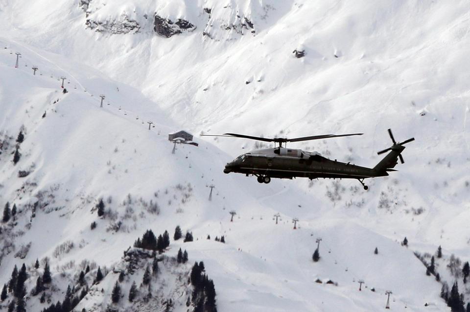 Trump's chopper manoeuvres about the towering snow covered mountains 