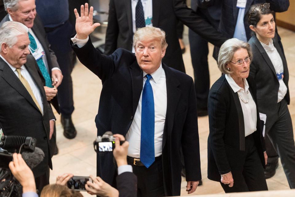 Donald Trump waves to delegates at the World Economic Forum in Davos