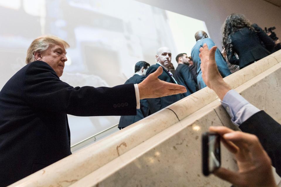Trump even appeared to high-five people as he arrived at the venue 
