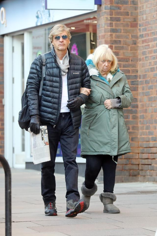  The pair looked glum as they strolled through Hampstead