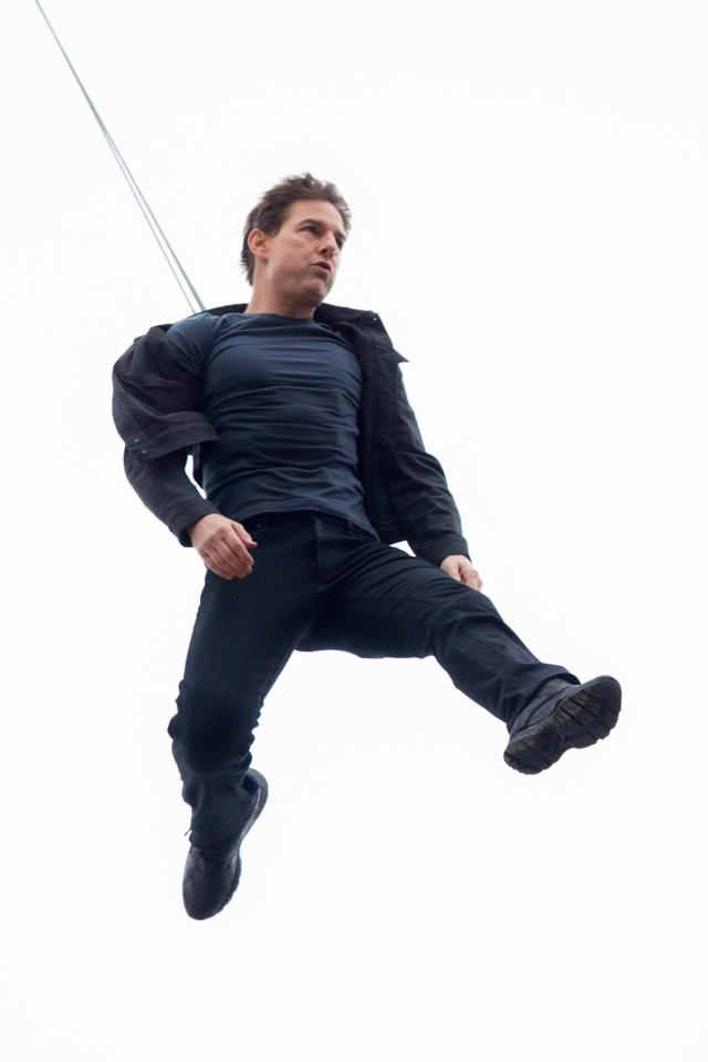 Tom was supported by a safety harness as he made the daring jump
