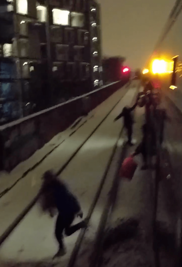  Police and fire service were drafted in after people were filmed leaping onto the tracks