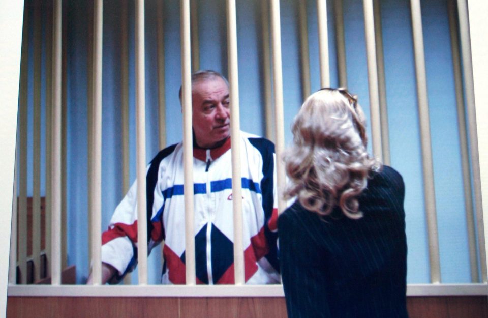  Ex-Russian spy Sergei Skripal is fighting for his life after being 'exposed to a chemical substance'; pictured speaking to his lawyer behind bars in Moscow in 2006