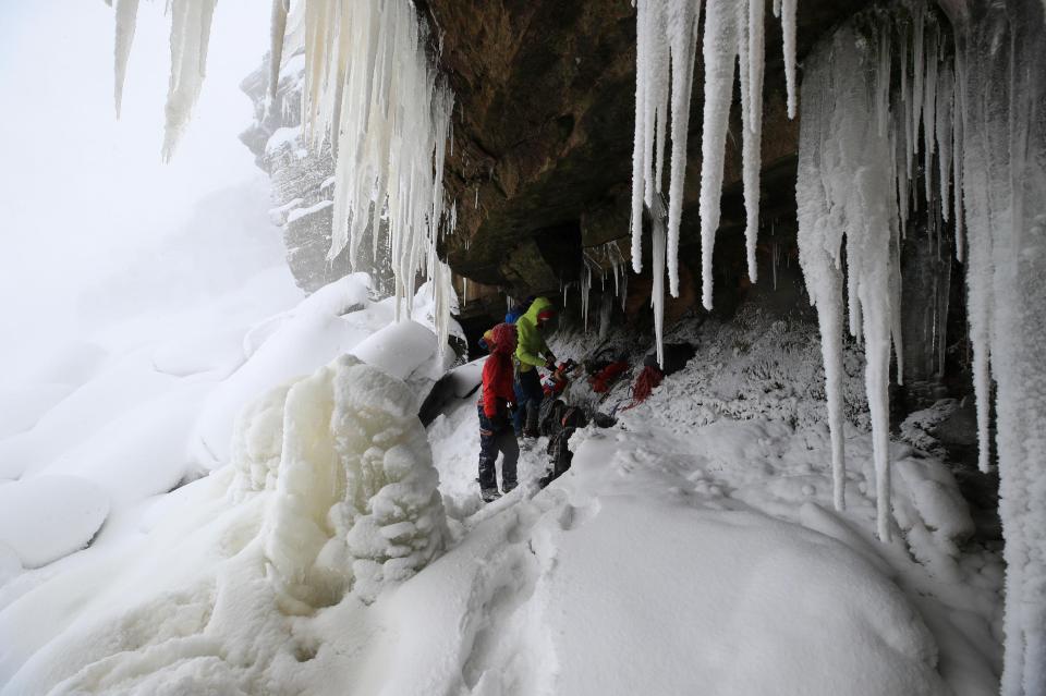  Ice climbers on the downfall at Kinder Downfall, High Peak in Derbyshire