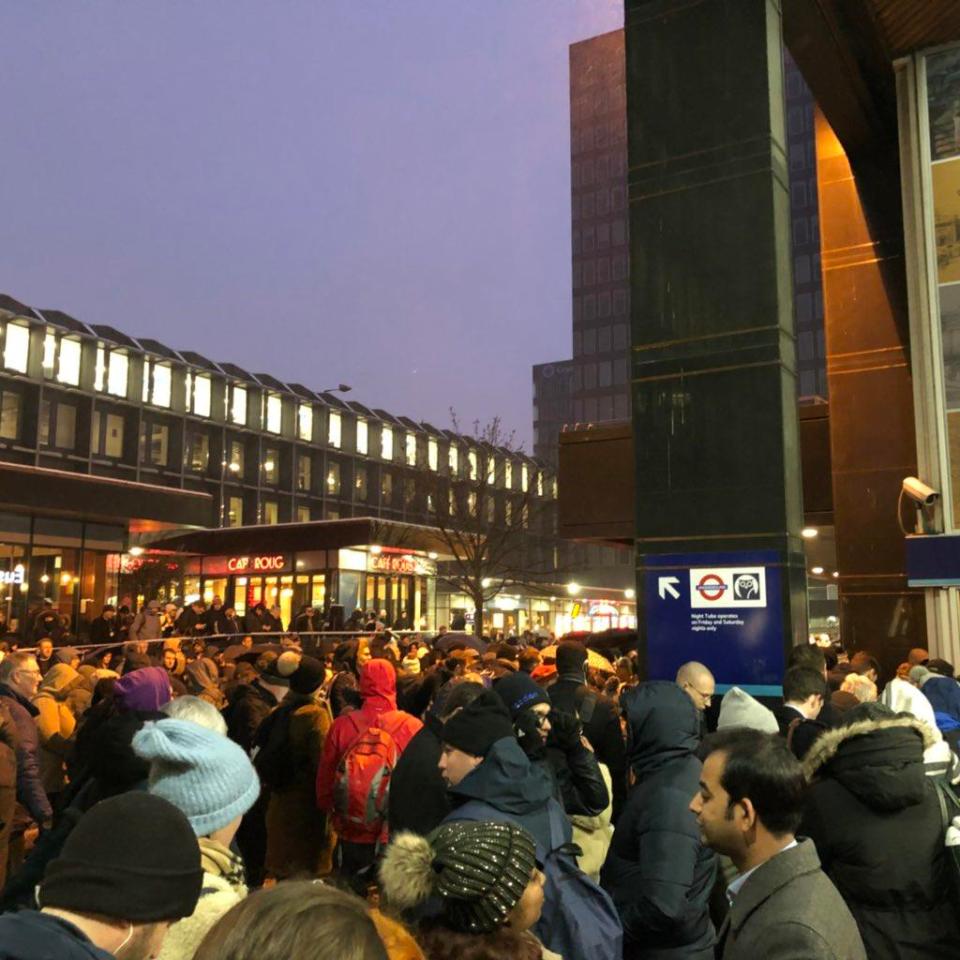  Hundreds of commuters wait in freezing temperatures outside Euston station