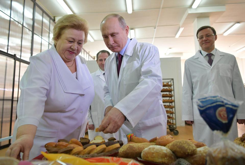  Vladimir Putin joked about his enemies 'swallowing poison' during a visit to a bakery