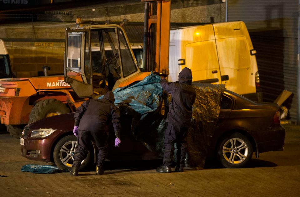 A Special police search team search a BMW at the Ashley Wood recovery yard in Salisbury