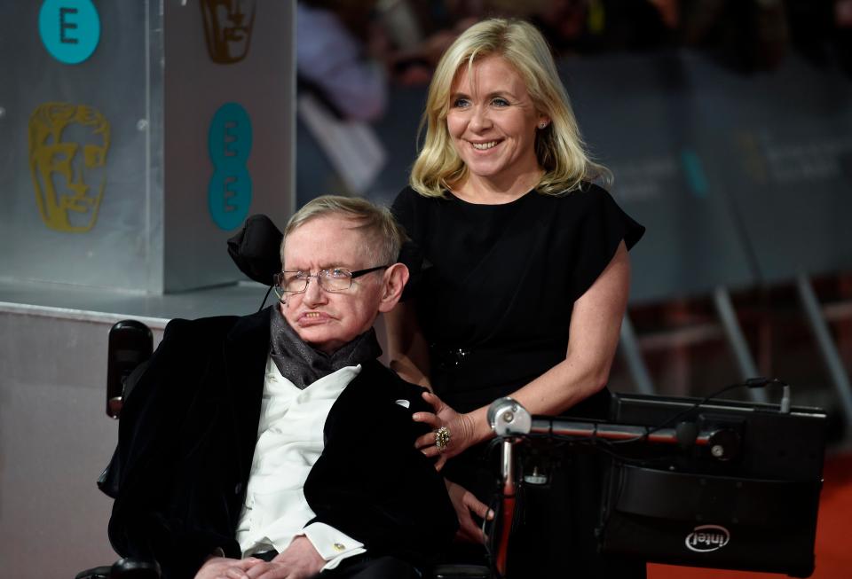  Stephen Hawking and his daughter Lucy Hawking arrive on the red carpet for the 2015 British Academy Film Awards