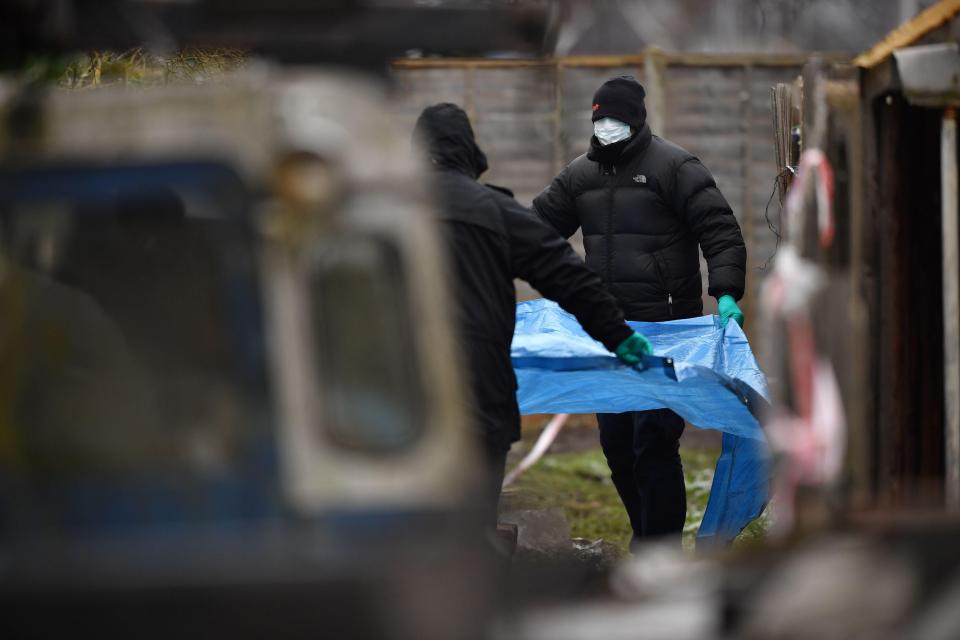Police officers were today pictured at Nikolai Glushkov's home in London after he died from 'compression to the neck'