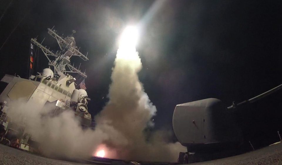 The guided-missile destroyer USS Porter fires a Tomahawk land attack missile on April 7, 2017 in the Mediterranean Sea in response to last year's chemical a