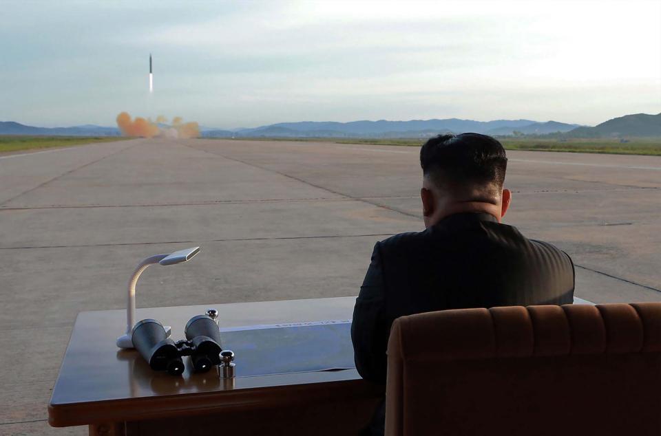 Kim oversees a test rocket launch last year